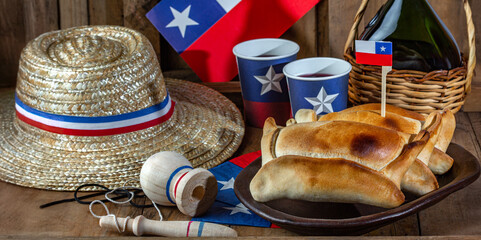 Chilean independence day concept. fiestas patrias. Tipical baked empanadas de pino, wine or chicha,...