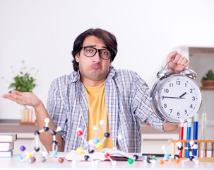 Young student physicist preparing for exam at home
