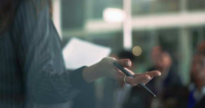 Business woman, hands and speaker with audience or team for corporate training, meeting or convention at office. Closeup of female person discussing company strategy or goals with group at conference