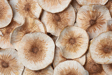 sun dried breadfruit slices or chips in close-up background, popular snack food ingredient, sliced thinly and laid out in the sun to dry, traditional method to extending shelf life