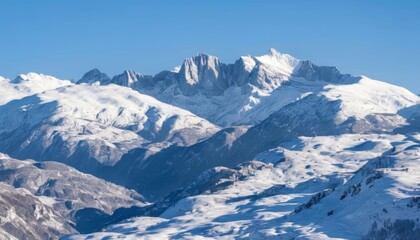  Majestic snowcapped mountain range under clear blue sky