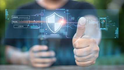 A man is giving a thumbs up to a screen that shows a security system