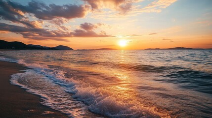 Obraz premium A stunning sunset over the ocean, with waves gently crashing on the sandy shore. A beautiful scene for relaxation and inspiration.