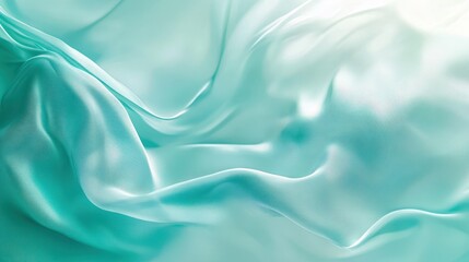 Obraz premium A close-up of smooth, flowing turquoise silk fabric, showcasing its texture and sheen.