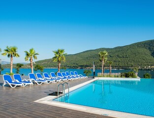 Nice swimming pool outdoors on bright summer day