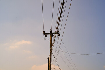 Panoramic Landscape of Electric pole with orange light of evening sky. Textured Details. Wallpapers...