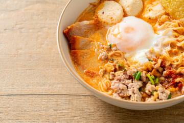 instant noodles with pork and meatballs in spicy soup