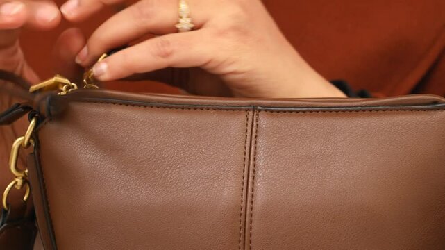 women looking for something in her purse