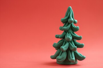 Christmas tree polymer clay isolate on red background