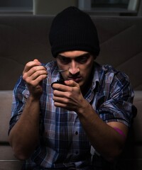 Young man in agony having problems with narcotics