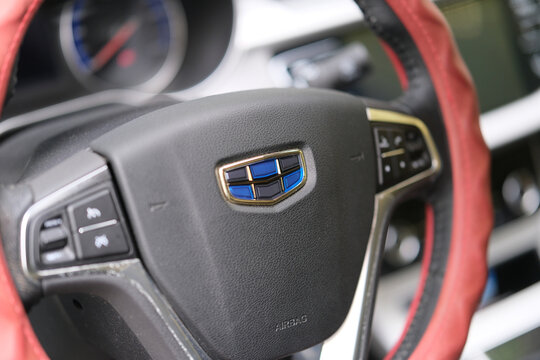 Wuhan,China-Oct.5th 2023:Geely company brand logo on steering wheel