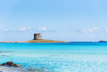 The iconic Torre de la Pelosa stands proudly on a small islet, surrounded by the crystal-clear...