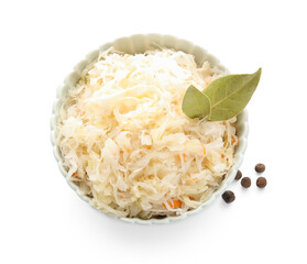 Bowl of delicious sauerkraut with bay leaves and peppercorn on white background