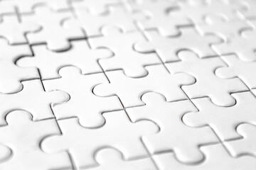 close up of white jigsaw puzzle