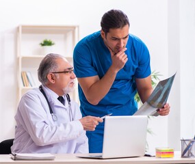 Two male doctors working in the clinic