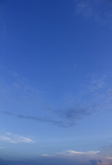 
It is a sunset sky with feathery clouds.