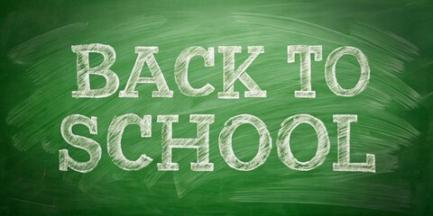 Obraz premium Back to School with text on a green school board written in chalk. Concept for educational and marketing materials on the topic of back to school