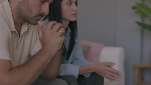 Fight, divorce, and depression with a couple on the sofa for conflict, therapy, and mental health or marriage counseling. 4K video