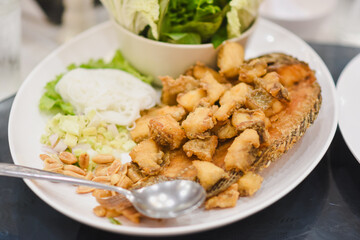 Fried tilapia on a plate on the table
