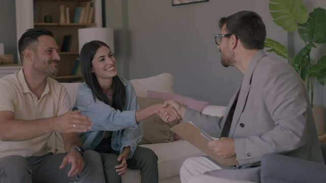Happy man and woman clients handshake close deal or close the agreement with a real estate agent. 4K video