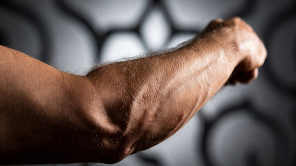 Hair on the arms of a muscular man