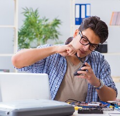 Vlogger recording computer repair on camera for vlog blog