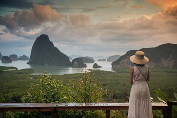 Asian woman enjoy Phang Nga Bay view from Samed Nang Chee