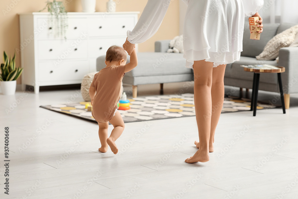 Sticker little baby girl learning to walk with mother at home, back view