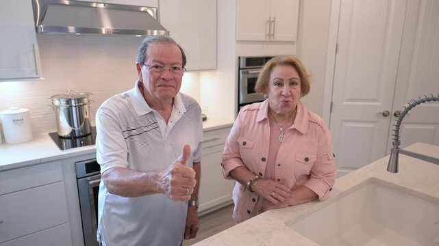 retired couple is happy with their new kitchen in their home