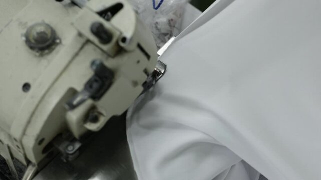 Efficient Fabric Handling and Sewing Process in a Modern Factory