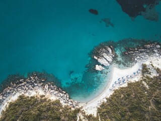 View of a beautiful beach with clear turquoise waters and rocky coastline on Zakynthos Island