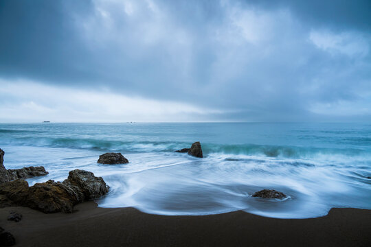 Sea stacks at the beach and dramatic sky, Aichi Prefecture, Japan