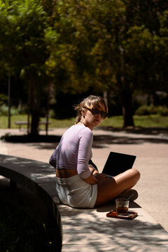Young woman using laptop cafe.