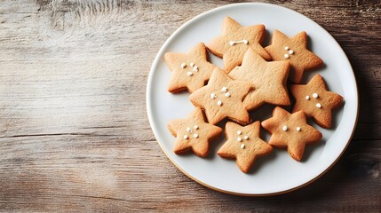Fototapeta premium A delectable display of freshly baked Christmas cookies in the shapes of stars trees and gingerbread men arranged on a ceramic serving plate ready to be enjoyed as a seasonal treat