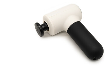 Modern massage gun for therapeutic muscle relaxation. percussion massager. copy space.