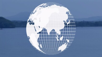 Rotating globe animation over serene lake with mountains in background - Powered by Adobe