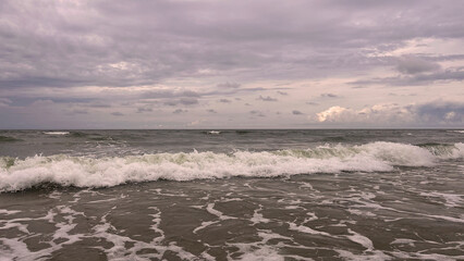 Seascape, stormy day on the Baltic Sea. Clouds meet the sea.