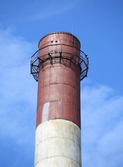 Factory chimney in the blue sky