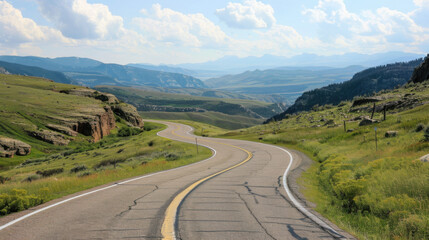 a long a and winding road that disappears off into the distance of a beautiful vista 