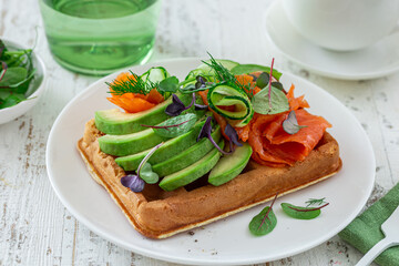 smoked salmon, avocado and cucumber waffle sandwich