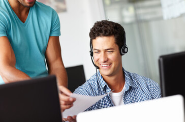 Happy man, call center and coach with script for consulting advice, help or assistance at office...