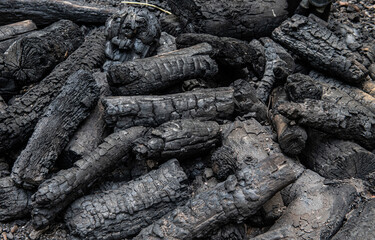Burnt wood in a pile  after a fire.