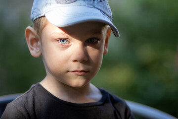 Portrait of a little boy with a cap