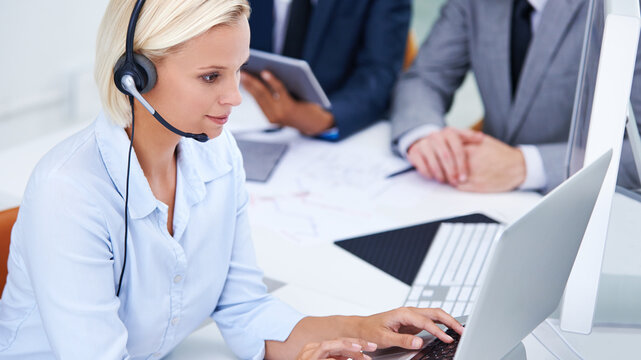 Call center, laptop and woman consultant in office for international customer service omnichannel. Contact us, headset and female technical support agent with global clientele for crm consultation.