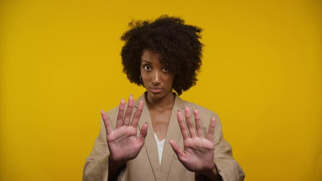 Woman Gesturing Stop with Both Hands Raised