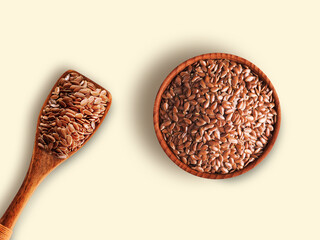 Flax Seeds in wooden bowl with spoon isolated on white background , top view , flat lay.