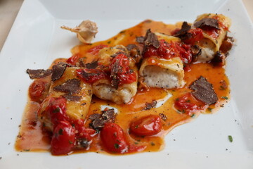 Italian cuisine: pasta with seafood sauce, goat cheese and black truffle in Amalfi, Italy