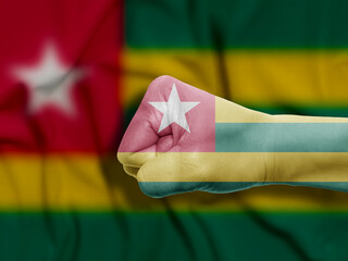 Fist of Togo Flag Painted, Flag Painted On Hand, Multi Purpose concept Isolated on Togo Background