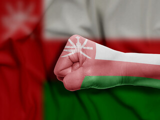 Fist of Oman Flag Painted, Flag Painted On Hand, Multi Purpose concept Isolated on Oman Background
