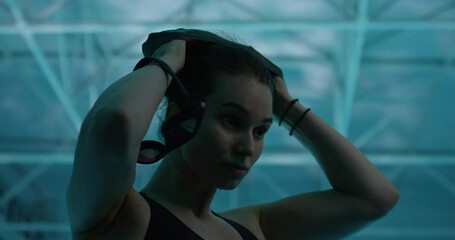 Woman putting a swimming cap on